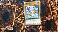 Rabidragon card on top of several Yu-Gi-Oh backs