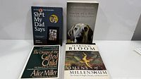 All four books laid flat showing front covers