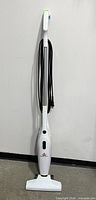 Full view of Bissell Featherweight vacuum standing upright