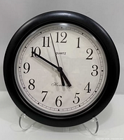 Front view of Horizon wall clock showing dial and frame