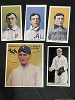 Fronts of five replica baseball cards displaying Magie, Plank, Wagner, Lajoie and Lewis