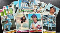 Spread of stacked Topps baseball cards showing variety of players and teams