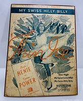 Front view of plaque displaying full sheet music cover artwork