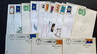 All envelopes and postcards fanned out showing stamps and cancels