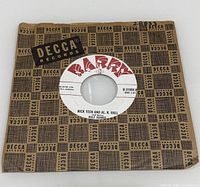 Record inside Decca sleeve showing Barry B-side label