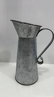 Full side view of galvanized pitcher vase