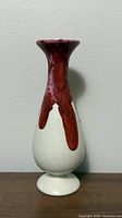 Front view of ceramic bud vase showing flambé glaze and crackle body