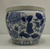 Front view of blue & white ceramic cachepot showing peony design