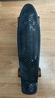 Top view of entire skateboard deck and wheels