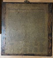 Full front view of Declaration plaque showing text and wood backing