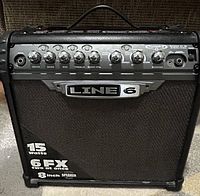 Front view of Line 6 Spider III amplifier showing grille, logo and 15W 6 FX labeling