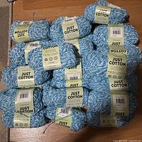 Stack of Premier Just Cotton skeins showing labels and color
