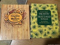 Front covers of both songbooks