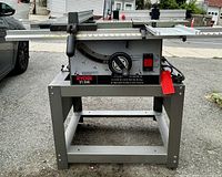 Front view of Ryobi BT3000 table saw on stand with rip fence and miter gauge attached