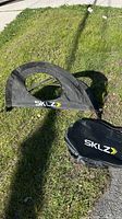 Pop-up net and carry bag on grass