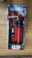 Front view of Kylo Ren BladeBuilders lightsaber in worn box