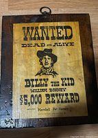 Full view of plaque showing entire poster on wood backing with metal hanger