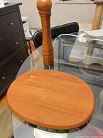 Dansk teak cheese board and pepper grinder on glass table