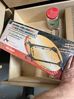 Front of sealed box showing product name and image of assembled mobile base