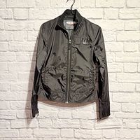 Full view of black nylon Triple Five Soul jacket on hanger