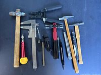 Group shot of all tools laid out on dark surface