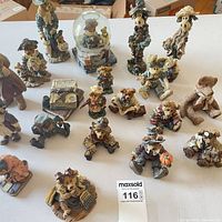 All nineteen Cherished Teddies items grouped on table