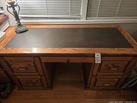 Full view of desk with inlay top and pedestals