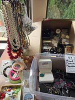 Overview of necklaces, bracelets, assorted earrings and boxes