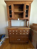 Full view of hutch showing upper and lower sections, drawers, doors, finish