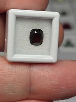 Cushion cut spinel in display box front view