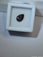 Pear-cut purple sapphire in display box