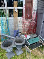 Group shot showing urns, trellises, kneeler bench, tub, wire fencing, sundial base