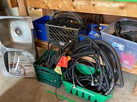 Sink, tile pack, bins with hoses visible