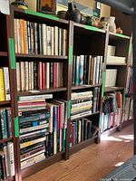 Front view of the three bookcases filled with books