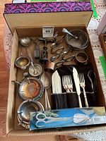 Overview of all silverplate items in box