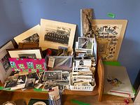 Overall lot showing loose photos, albums, framed items, and German print