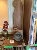 Full view of grinder showing wood backplate, box, cast iron funnel and crank