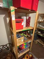 Full view of wood shelving unit loaded with assorted items (not included)