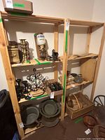 Full view of light-wood 4-tier shelving unit with various items on shelves (not included)