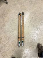 Two hose sections side by side on concrete floor