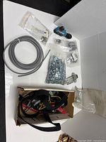 Top view of all items including cable, sensor, hardware, straps