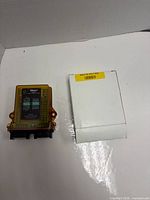 Module and original box side by side