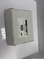 Closed white Code 3 box showing product label