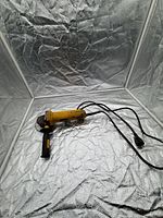 Full view of grinder with cord and handle