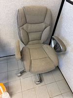Front view of gray-beige ergonomic high-back office chair