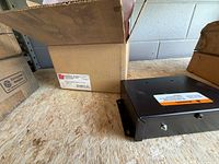 Power supply beside original box on shelf