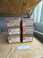 Six boxed Federal Signal lamps on table showing labels