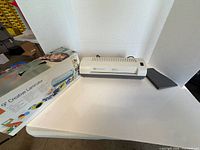 GBC Creative 9 laminator with carrier tray and original box displayed on table