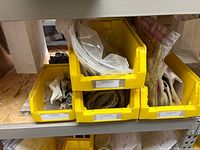 Stacked yellow bins containing sealed Hale repair kits