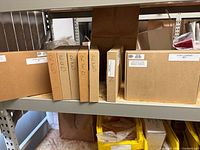 Multiple labelled Hamsar cartons on shelf